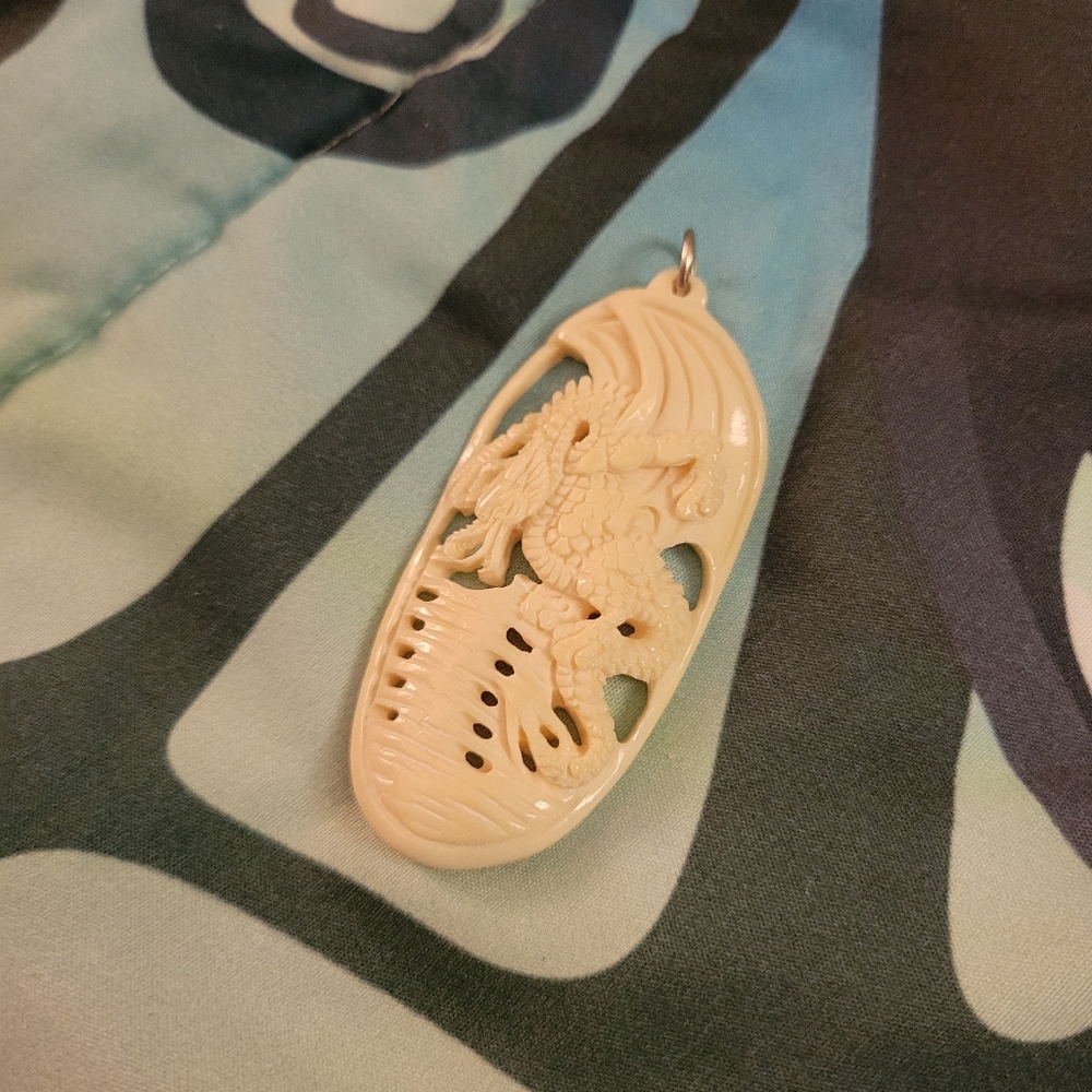 Carved Bone Dragon Pendant